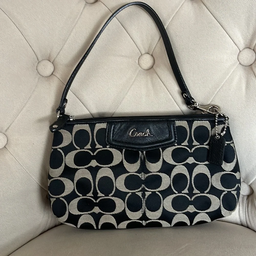 Coach black and tan jacquard logo and black leather clutch wristlet
